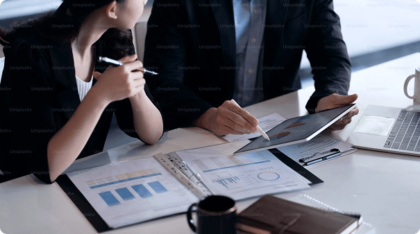 Business professionals analyzing data and charts